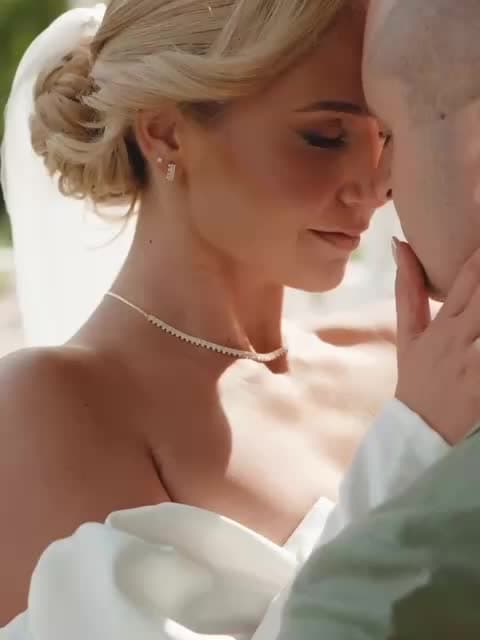 Newlyweds embracing at sunset